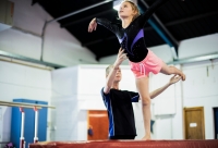 gymnast en trainer